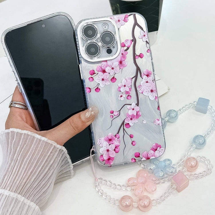 For iPhone 16e Electroplating Flowers Plants Texture Wristband TPU Phone Case(Peach Blossom FL18) - iPhone 16e Cases by PMC TechLife | Online Shopping South Africa | PMC TechLife | Buy Now Pay Later Mobicred